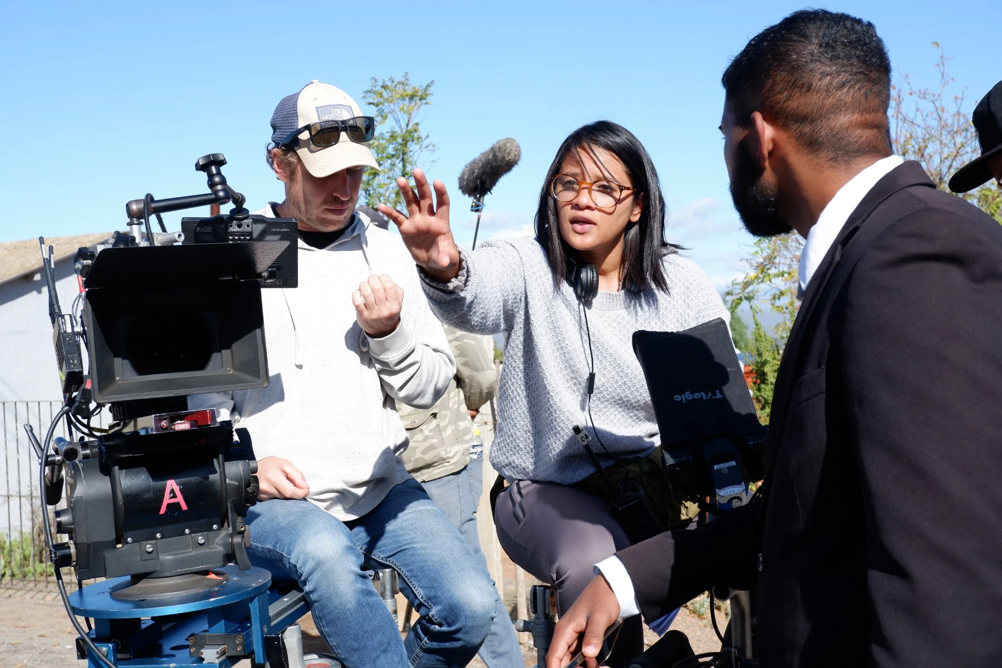 Muneera Sallies directing a performer beside the cinema camera